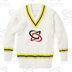 Classic white cricket sweater with cable knit design